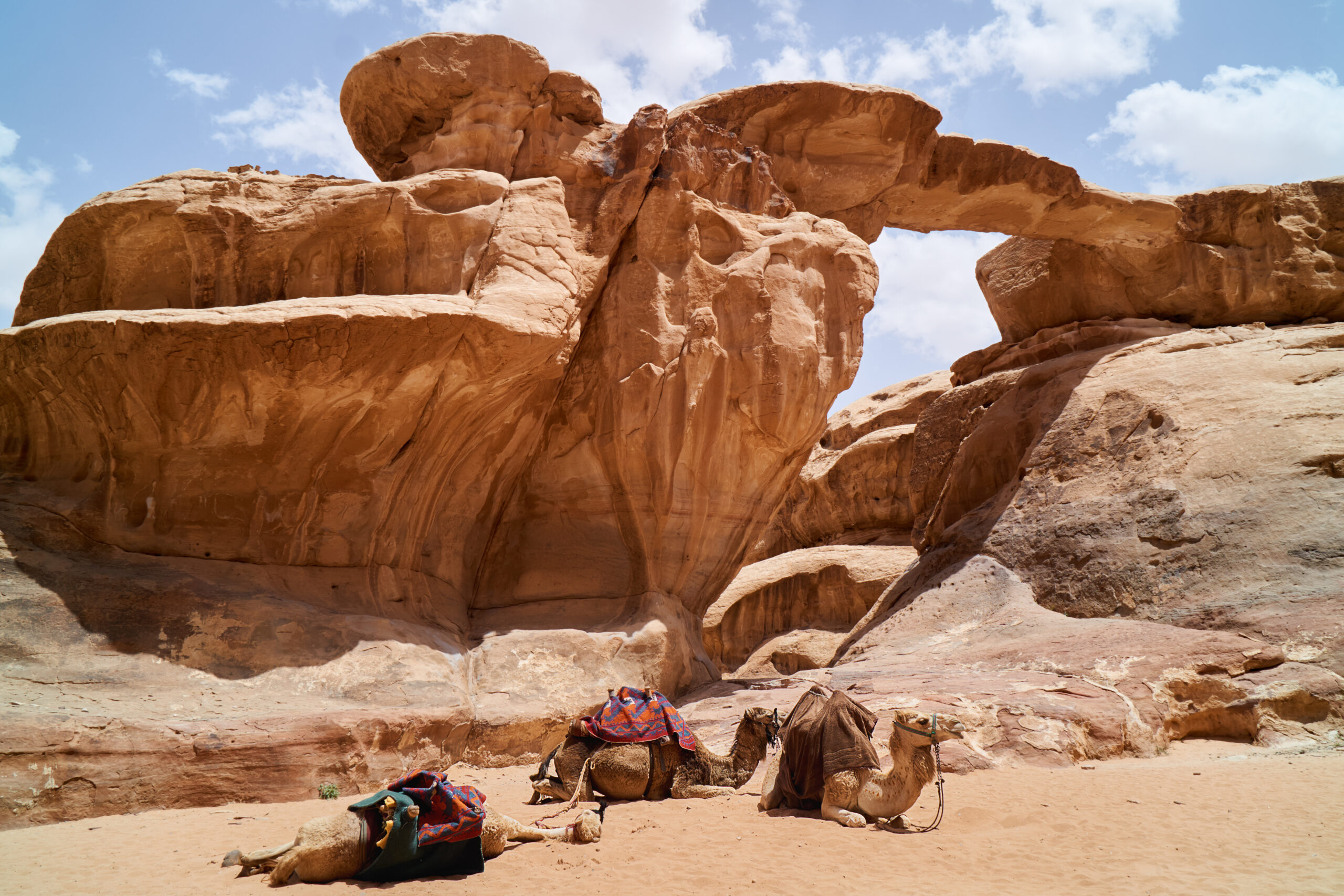 Tourists at Um Fruth rock arch in Wadi Rum