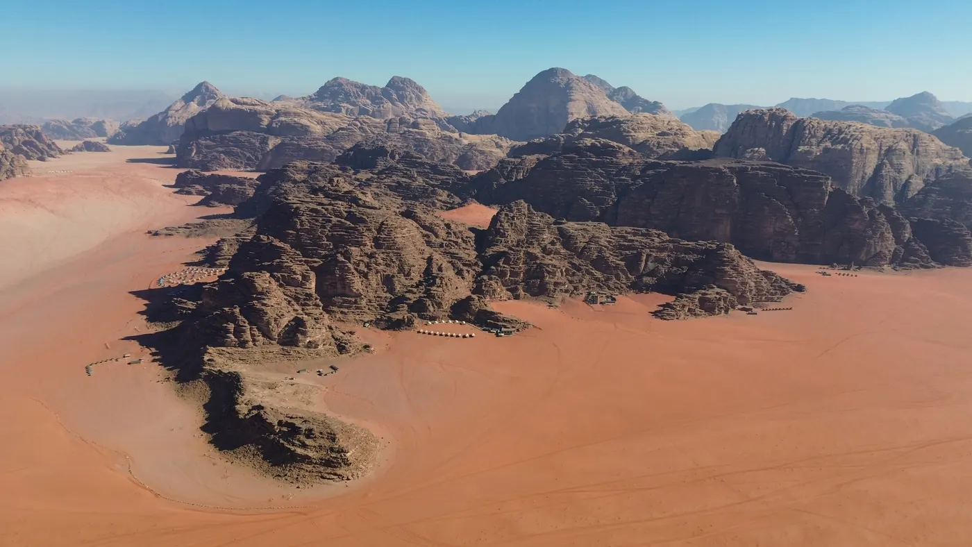 Aerial view of the rock massifs and sand of Wadi Rum